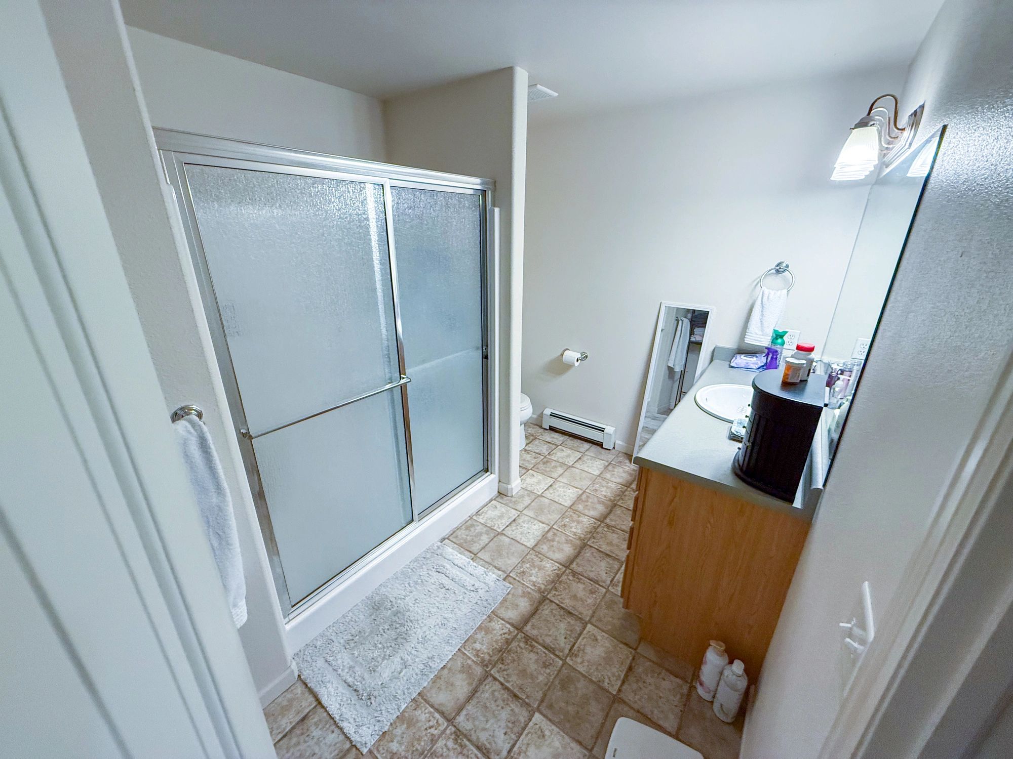 Bathroom with vanity and shower enclosure for residential remodeling in Hawaii